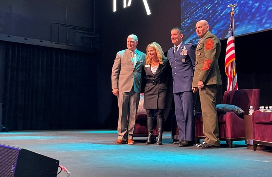 Brook Keesler, AFCEA Central Maryland Chapter president, presents AFCEA Maryland Chapter coins