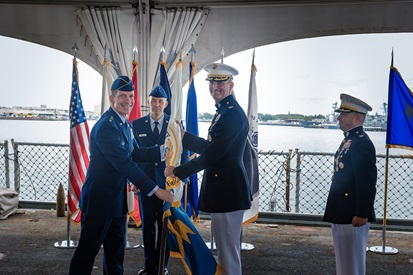 Image of Air Force Lt. Gen. Robert J. Skinner, Defense Information Systems Agency director and Joint Force Headquarters-Department of Defense Information Network commander, Marine Corps Col. Matthew R. Simmons, outgoing DISA Pacific Command commander, and Marine Corps Col. Jared C. Voneida, incoming DISA Pacific Command commander, stand at attention as the change of command ceremony begins on July 15 aboard USS Missouri at Ford Island, Hawaii. Photo by Parish M. Kaleiwahea, DISA/Released.