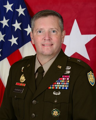 Official photo of Army Brig. Gen. Joseph A. Papenfus posing in front of the United States flag and the 1-star general flag.
