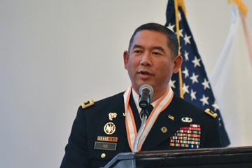 Major Gen. Garrett Yee speaks during his retirement ceremony