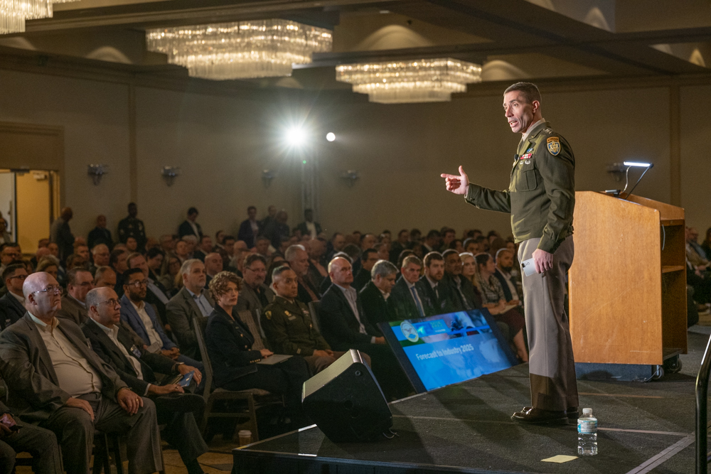 Army Lt. Gen. Paul T. Stanton, Defense Information Systems Agency director and Department of Defense Cyber Defense Command commander, stands on stage in front of the crowd at the Forecast to Industry event.