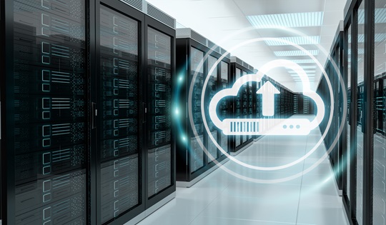 A server room with a digital cloud logo imposed over it