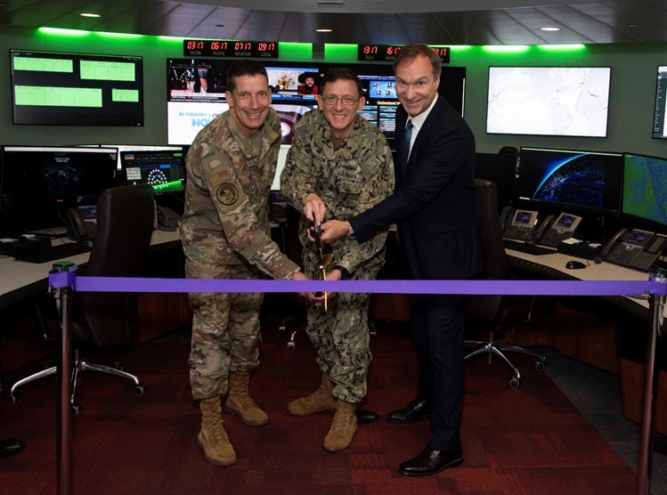  Air Force Lt. Gen. Robert F. Skinner, left, Defense Information Systems Agency director and commander of the Joint Force Headquarters - Department of Defense Information Network, U.S. Navy Capt. Rick Larson DISA Joint Operations Center director, center, and Joseph Wassel, DISA Cyberspace Operations  cut watch floor ribbon